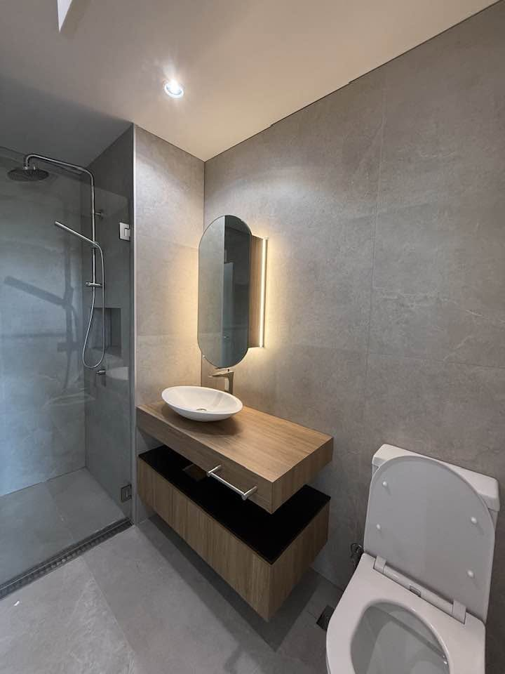 Bathroom vanity with timber joinery and mirror lighting